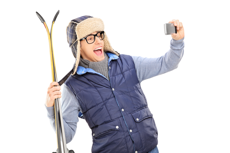 http://www.dreamstime.com/stock-image-man-winter-clothes-taking-selfie-skis-isolated-white-background-image39419591