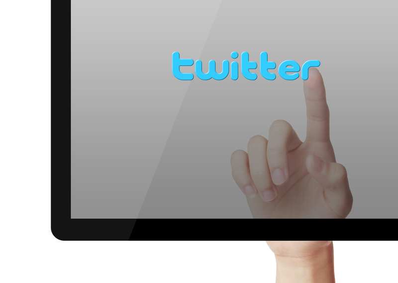 http://www.dreamstime.com/royalty-free-stock-photography-twitter-concept-hand-press-button-blue-background-image41174297
